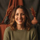 Close-up, diverse portrait of a happy woman in her 30s, exuding confidence and satisfaction.